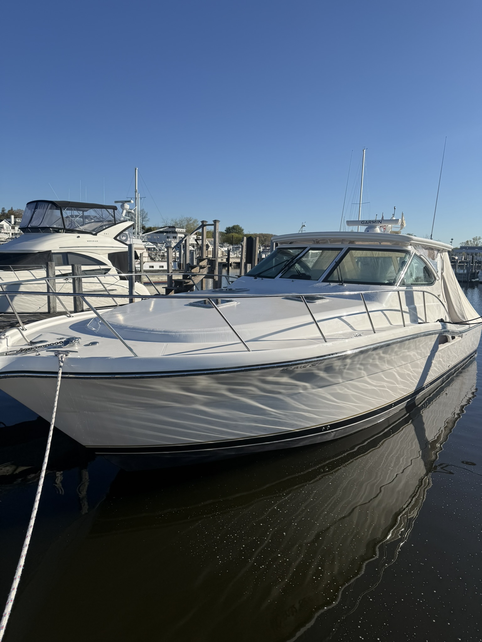 Freshly detailed white cruiser at a West Michigan marina